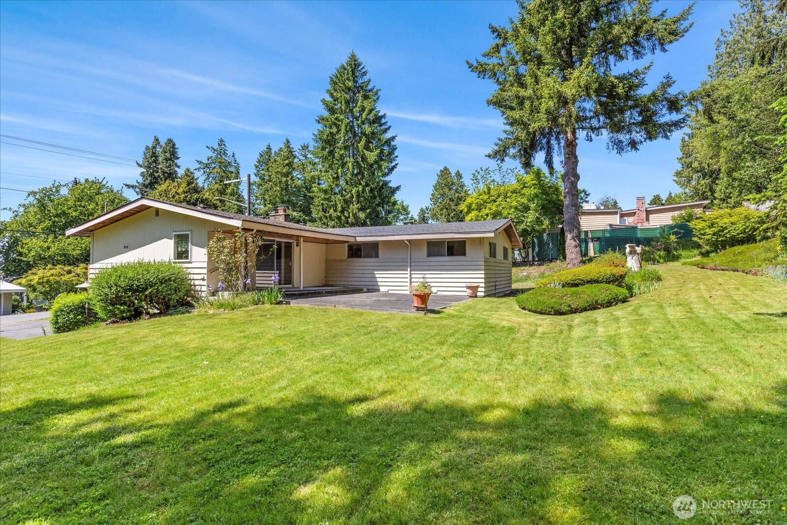 1420 Olympic Avenue Edmonds, WA 98020 - Photo 34 of 40 a front view of a house with a yard and trees