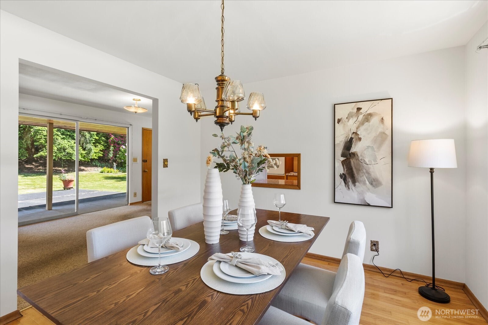 1420 Olympic Avenue Edmonds, WA 98020 - Photo 9 of 40 a view of a dining room with furniture a chandelier and wooden floor
