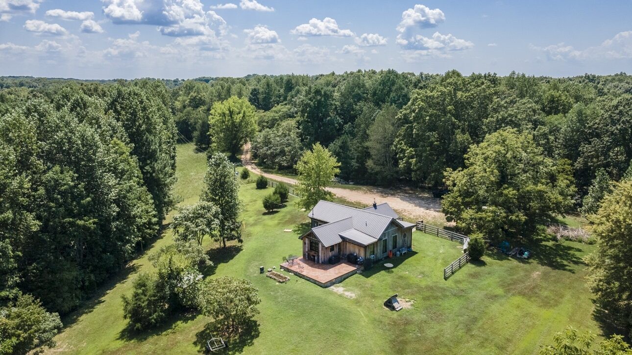 an aerial view of backyard with swimming pool