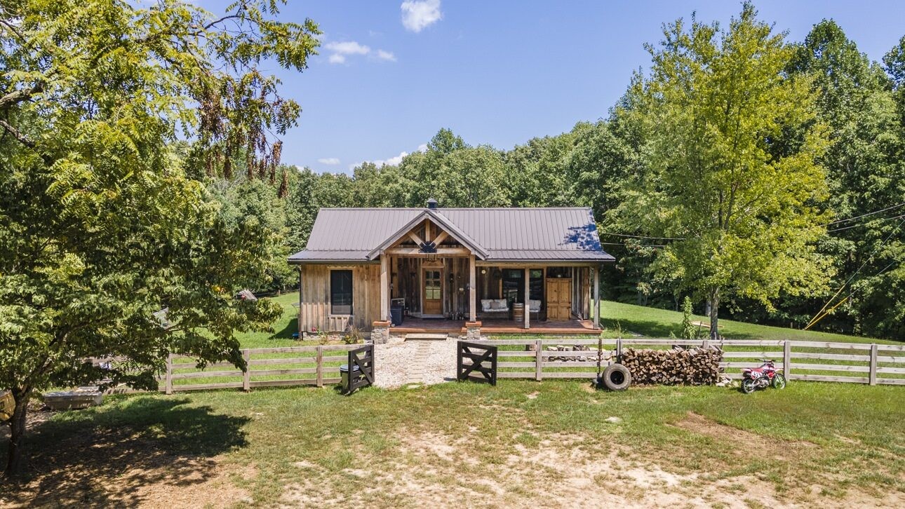 5656 Walter King Road Franklin, TN 37064 - Photo 12 of 36 a front view of a house with a yard table and chairs