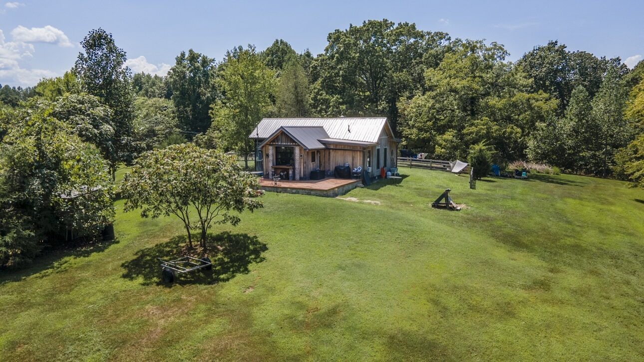 5656 Walter King Road Franklin, TN 37064 - Photo 2 of 36 an aerial view of a house with a yard and trees
