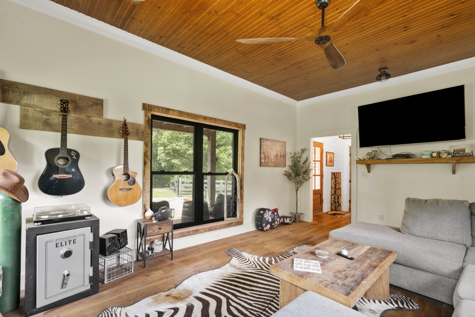 5656 Walter King Road Franklin, TN 37064 - Photo 27 of 36 a bedroom with furniture and a flat screen tv