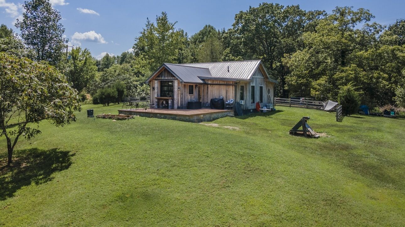 5656 Walter King Road Franklin, TN 37064 - Photo 3 of 36 a aerial view of a house with swimming pool and garden