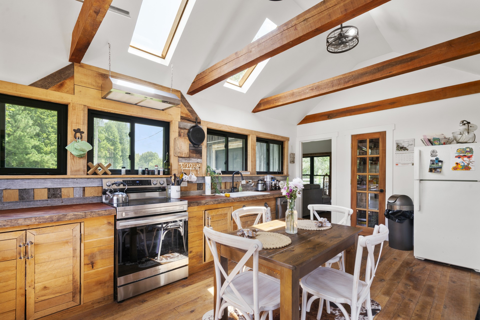 5656 Walter King Road Franklin, TN 37064 - Photo 31 of 36 a dining table chairs and a stove