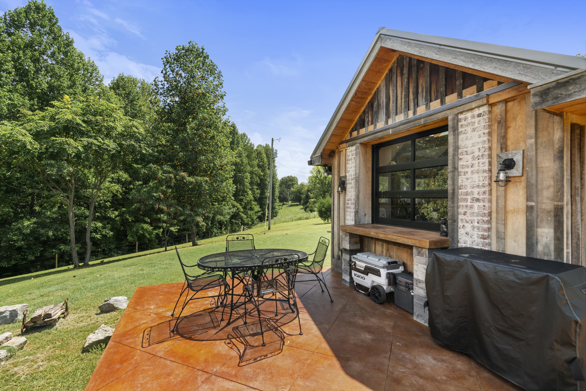 5656 Walter King Road Franklin, TN 37064 - Photo 10 of 36 a backyard of a house with table and chairs