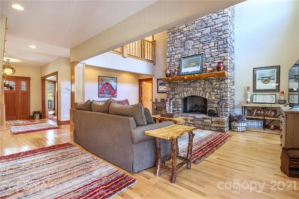 249 Ox Creek Road Weaverville, NC 28787 - Photo 2 of 32 a living room with furniture and a fireplace