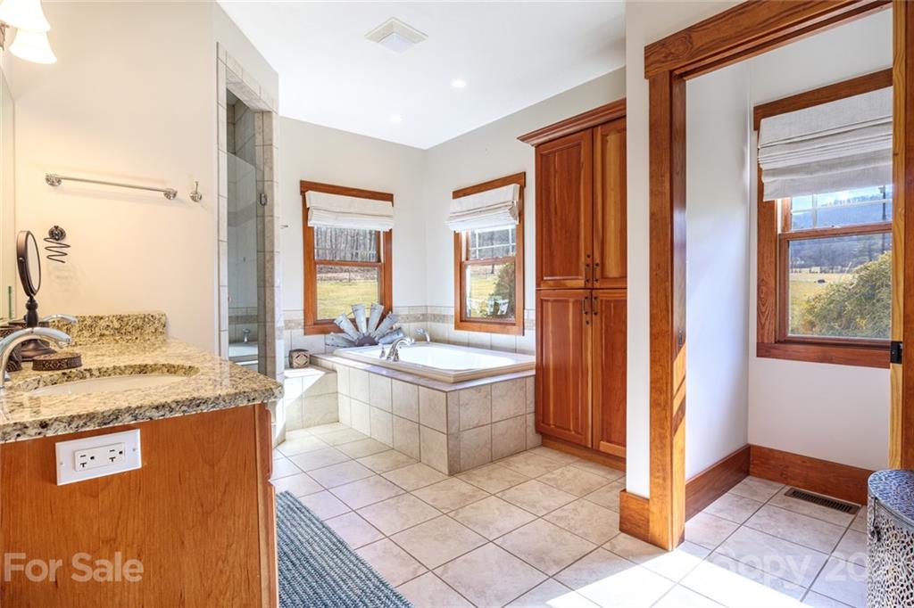 249 Ox Creek Road Weaverville, NC 28787 - Photo 11 of 32 a large white kitchen with a large window