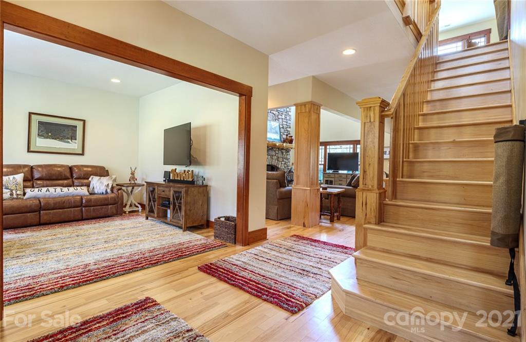 249 Ox Creek Road Weaverville, NC 28787 - Photo 12 of 32 a living room with furniture and a rug