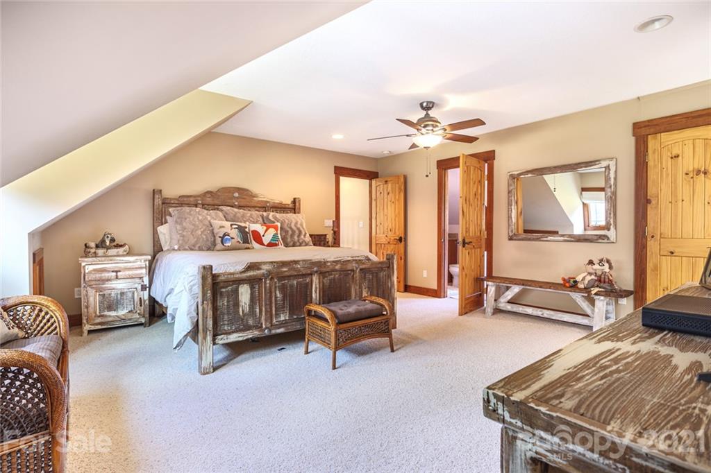 249 Ox Creek Road Weaverville, NC 28787 - Photo 15 of 32 a bedroom with furniture and a large window