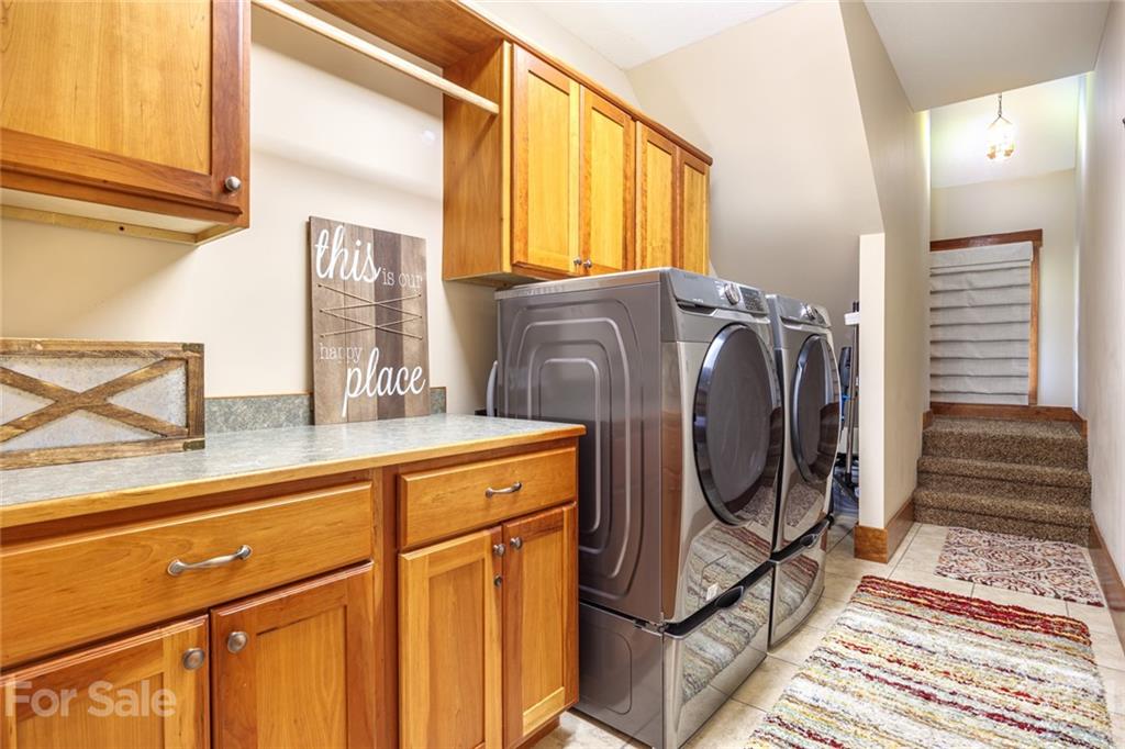 249 Ox Creek Road Weaverville, NC 28787 - Photo 24 of 32 a utility room with wooden floor washer and dryer