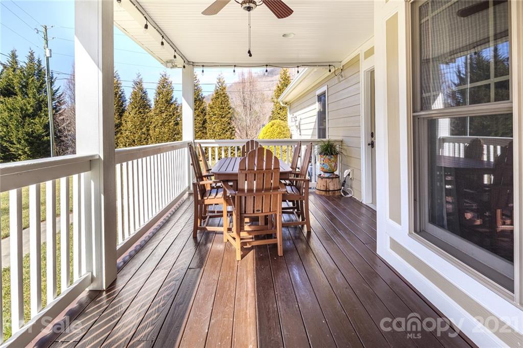 249 Ox Creek Road Weaverville, NC 28787 - Photo 28 of 32 a view of a city from a balcony with furniture