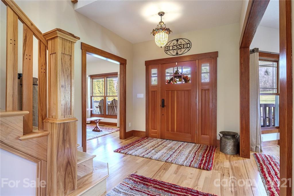 249 Ox Creek Road Weaverville, NC 28787 - Photo 32 of 32 a view of a hallway view with wooden floor and staircase