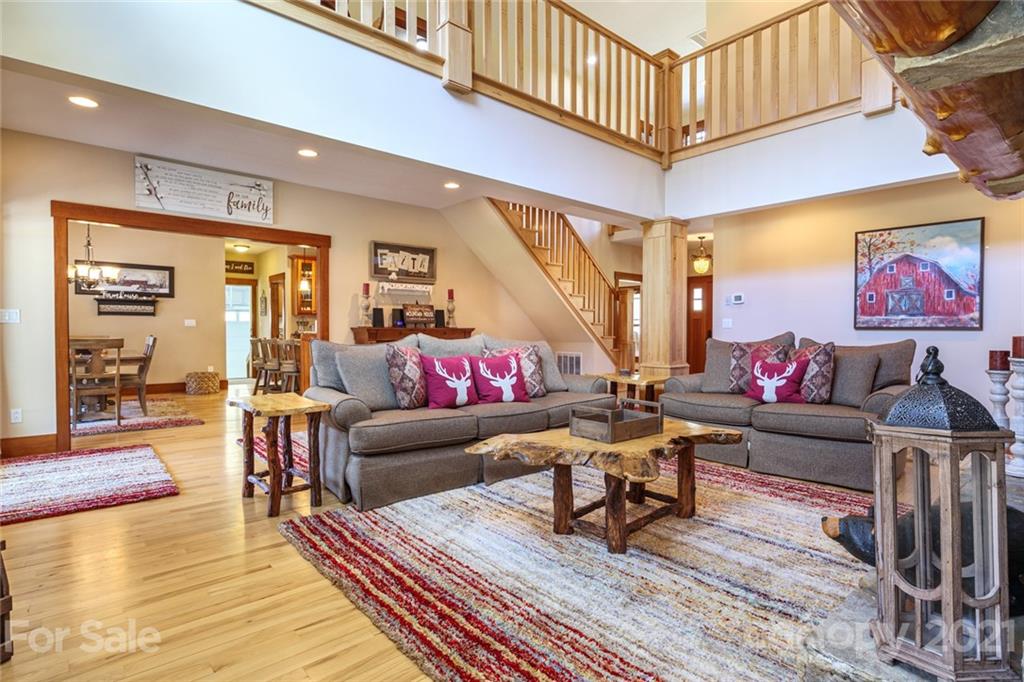 249 Ox Creek Road Weaverville, NC 28787 - Photo 5 of 32 a living room with furniture and wooden floor