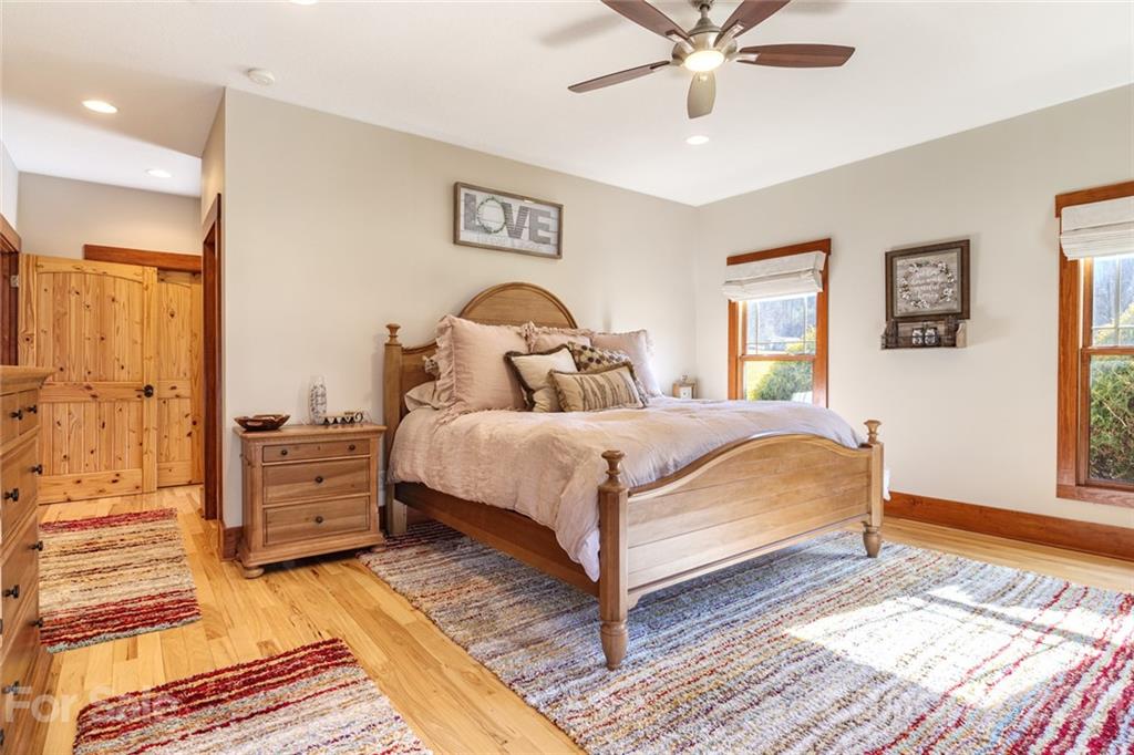 249 Ox Creek Road Weaverville, NC 28787 - Photo 9 of 32 a bedroom with a bed and a window