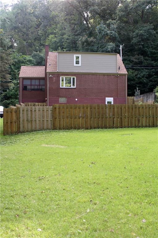 104 Buckhill Road Pittsburgh, PA 15237 - Photo 17 of 21 Partially Fenced in Large Back Yard. New Siding on Back Exterior.