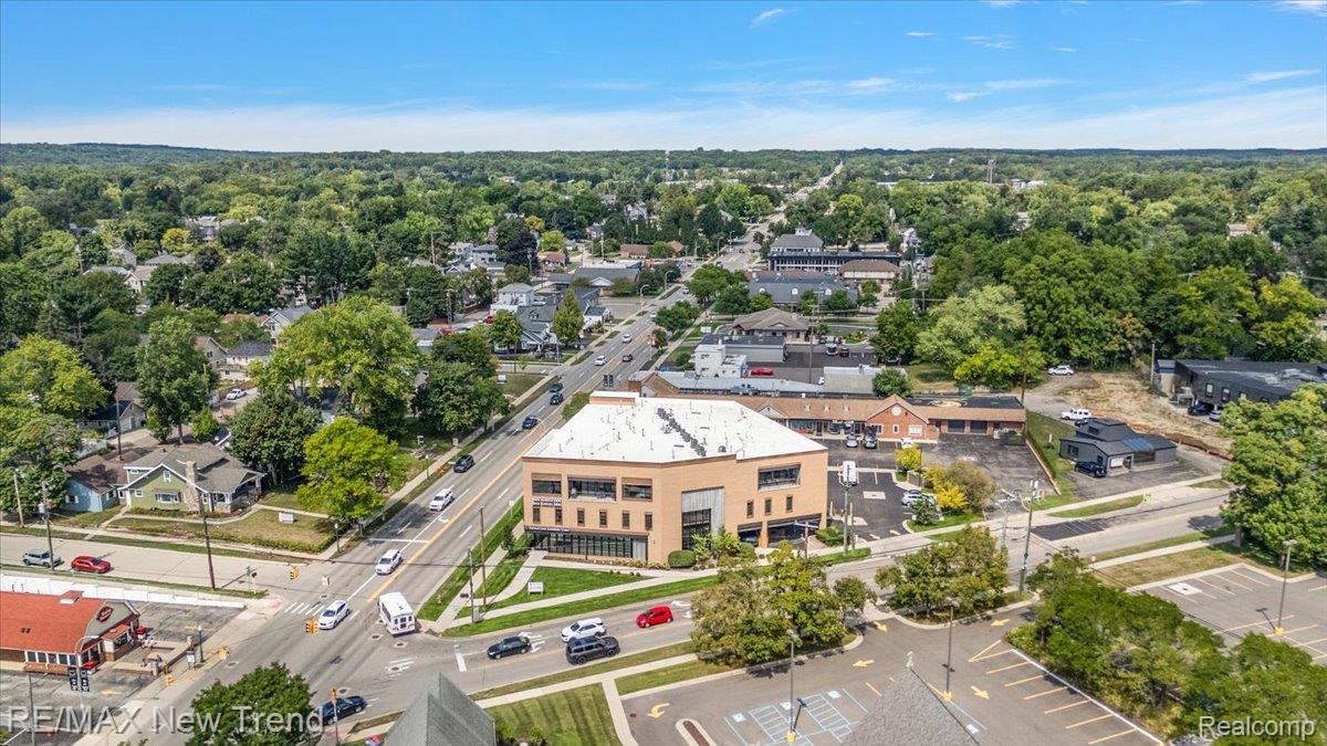804 North Main Street, Unit 2H Rochester, MI 48307 - Photo 50 of 52 Commercial building featuring multiple levels, numerous windows, and a prominent position along a thoroughfare