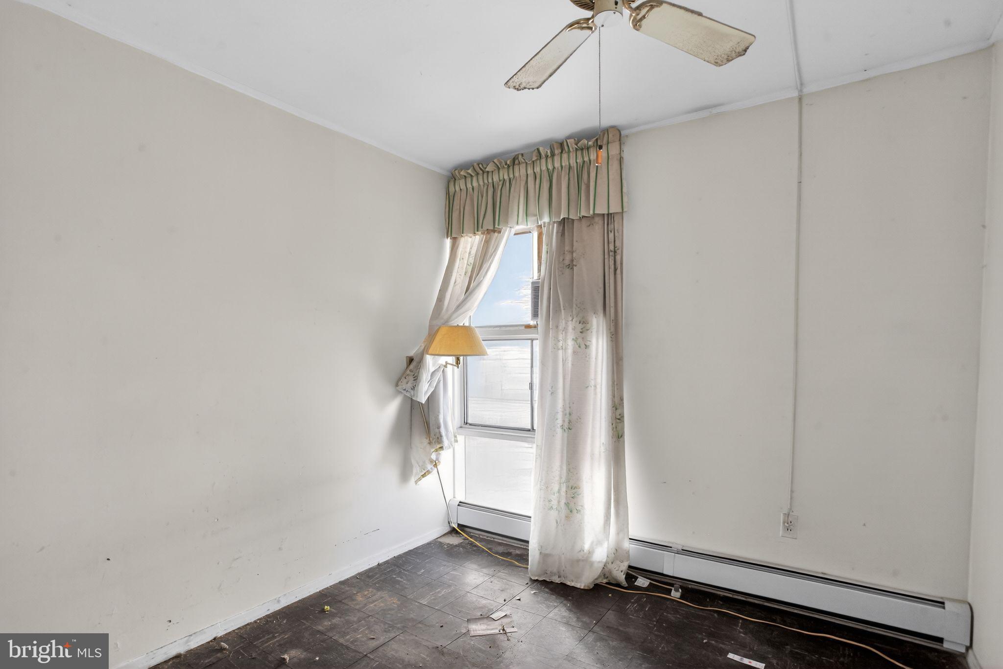 6 Field Lane Levittown, PA 19055 - Photo 11 of 20 a view of empty room with a ceiling fan
