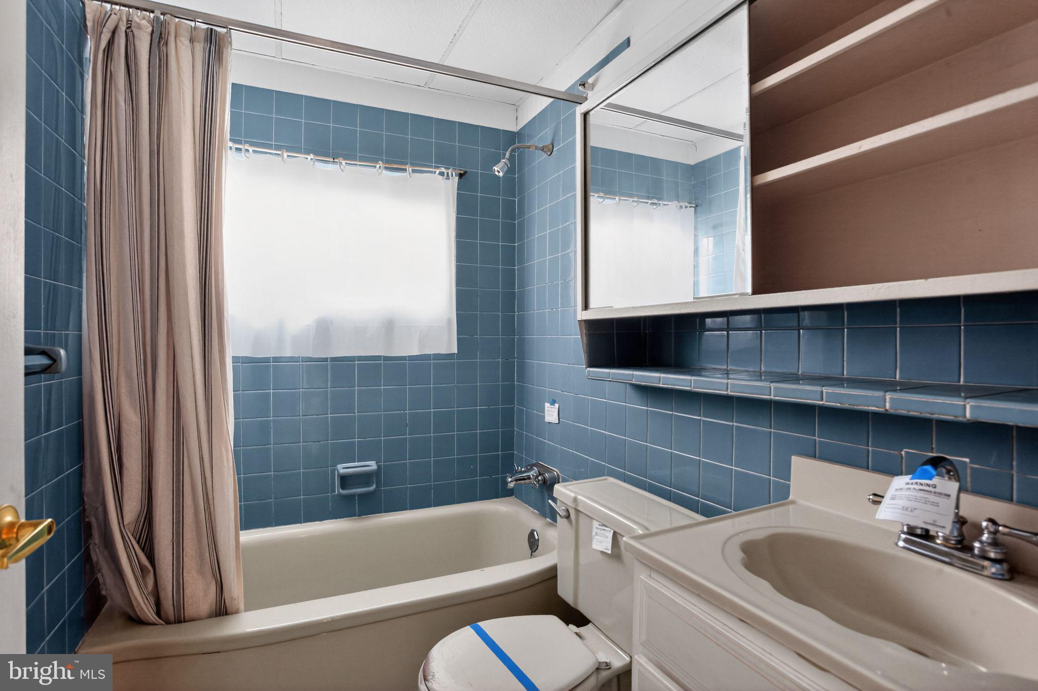 6 Field Lane Levittown, PA 19055 - Photo 14 of 20 a bathroom with a tub a sink and a toilet