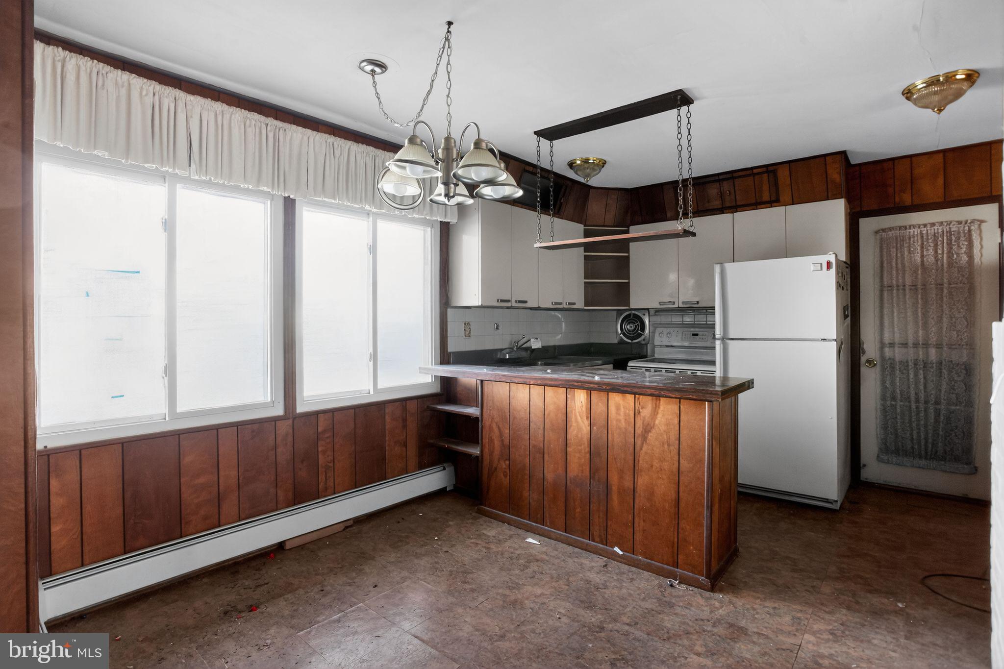 6 Field Lane Levittown, PA 19055 - Photo 8 of 20 a kitchen with stainless steel appliances granite countertop a refrigerator a sink and a stove