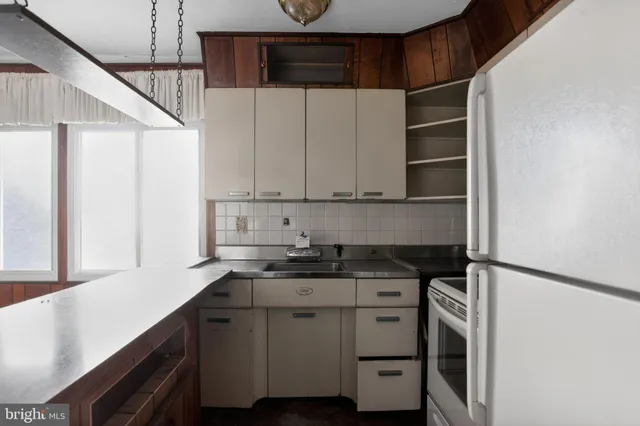 a kitchen with a sink and cabinets