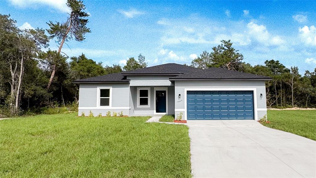 15625 Southwest 37th Circle Ocala, FL 34473 - Photo 1 of 27 a front view of house with yard and trees in the background