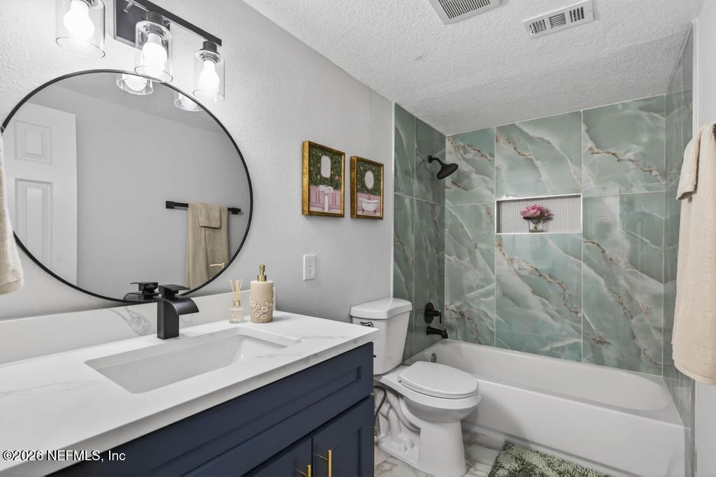 43739 Ratliff Road Callahan, FL 32011 - Photo 35 of 55 a bathroom with a sink a toilet and shower