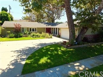 11336 Wembley Road Los Alamitos, CA 90720 - Photo 1 of 1 a view of a house with garden and a tree