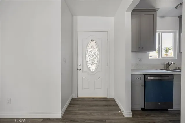 a view of an entryway with wooden floor