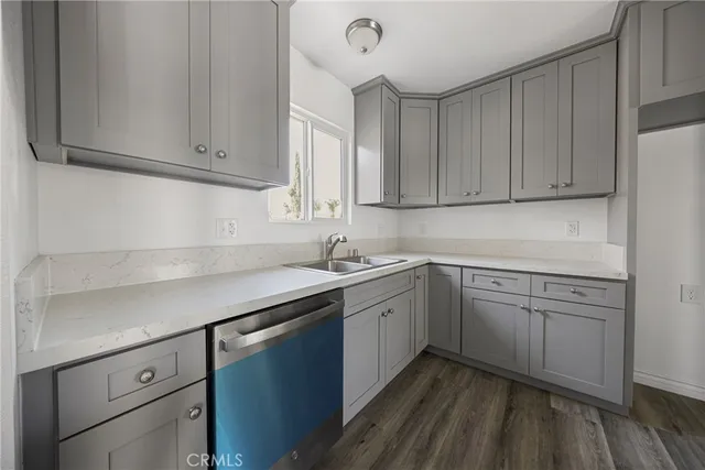a kitchen with sink cabinets and window