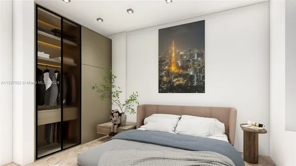 a bedroom with furniture and a potted plant