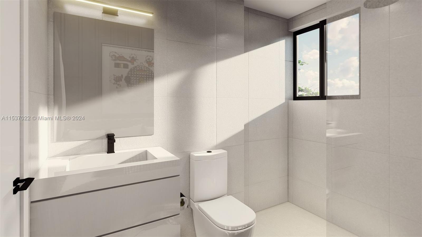Flamingo-Lummus Miami Beach, FL 33139 - Photo 9 of 15 a bathroom with a toilet sink and a mirror