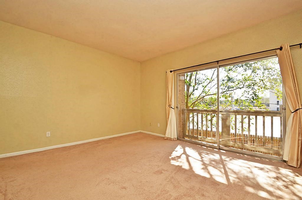2100 Tanglewilde Street, Unit 351 Houston, TX 77063 - Photo 8 of 12 a view of empty room with floor to ceiling window
