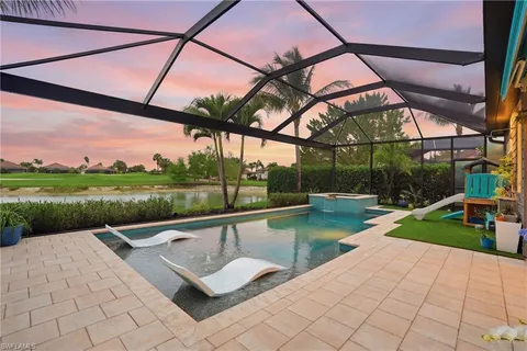 a view of a swimming pool with a patio