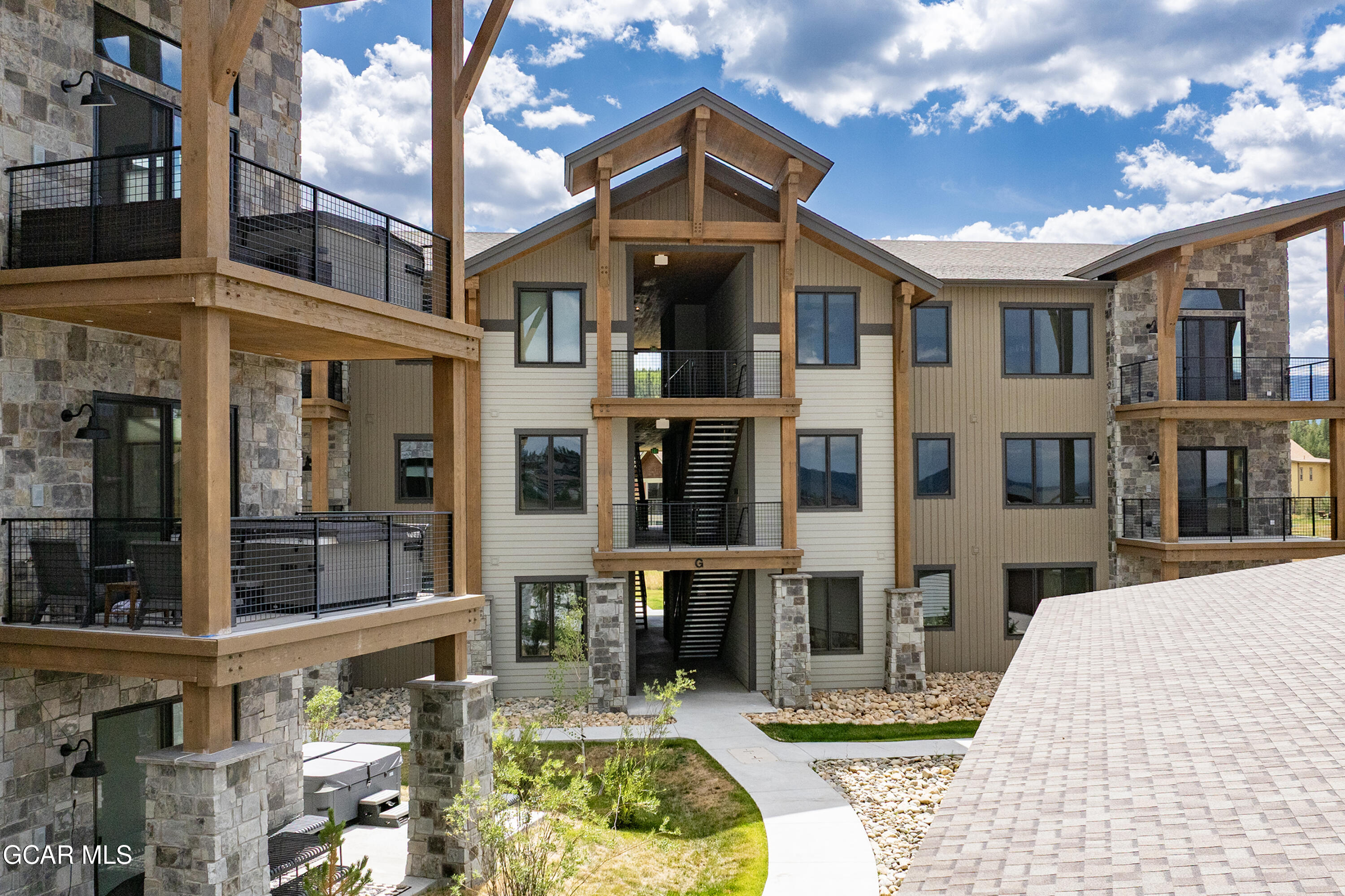 96 Meadow Trail, Unit G304 Fraser, CO 80442 - Photo 33 of 37 a front view of a building with glass windows