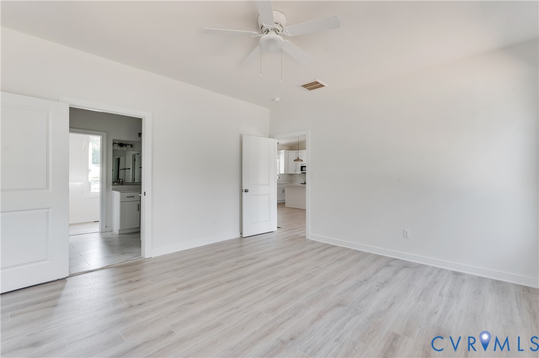 1393 Broad St Road Oilville, VA 23129 - Photo 23 of 39 Unfurnished bedroom featuring light wood-type floo