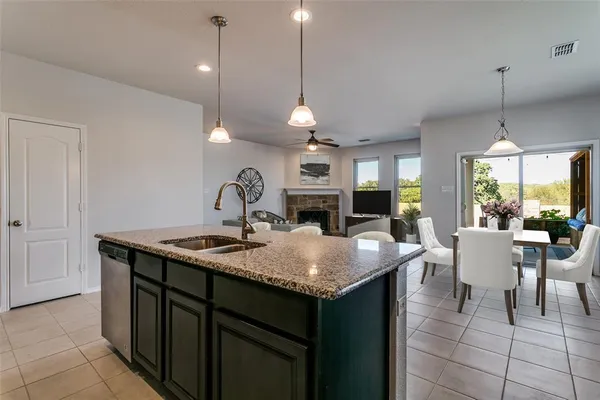 a dining table with a sink and chandelier