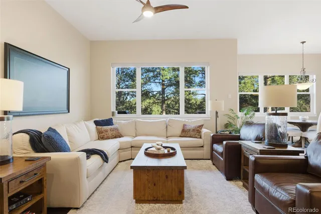 a living room with furniture and a window