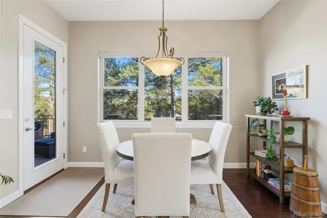 a dining room with furniture mountain view and a window