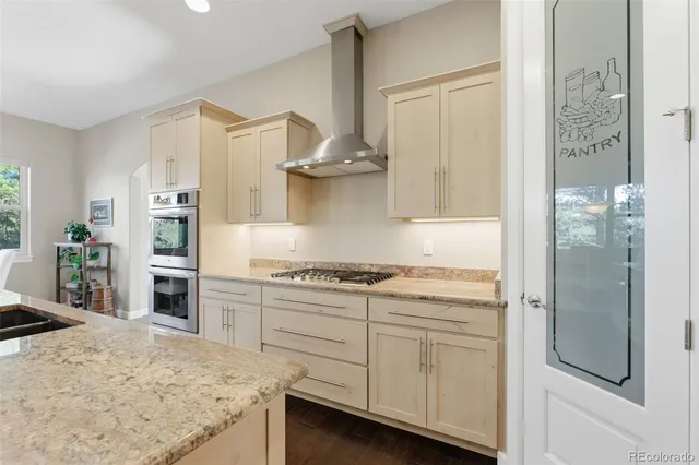 a kitchen with cabinets and a stove