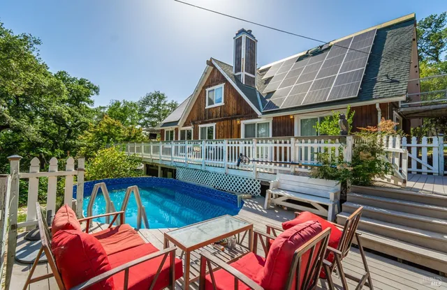 a view of a patio with a table and chairs