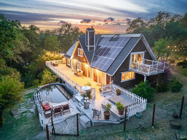 a aerial view of a house with a yard