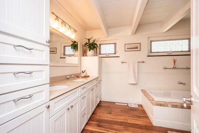 a bathroom with a bathtub and a sink