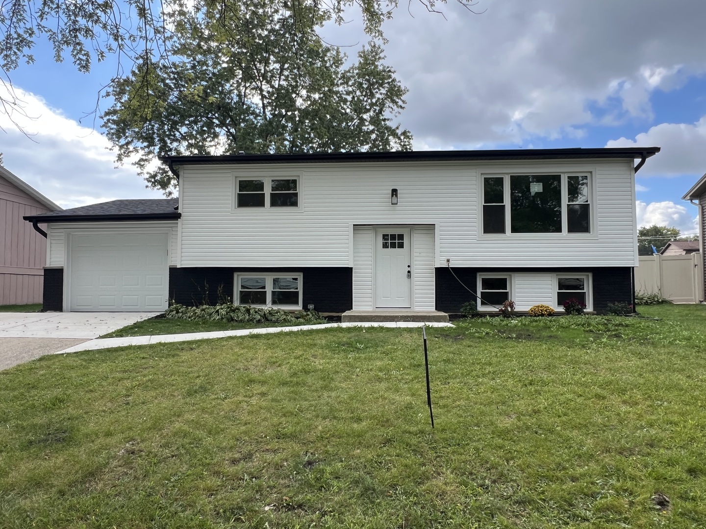 a house view with a garden space