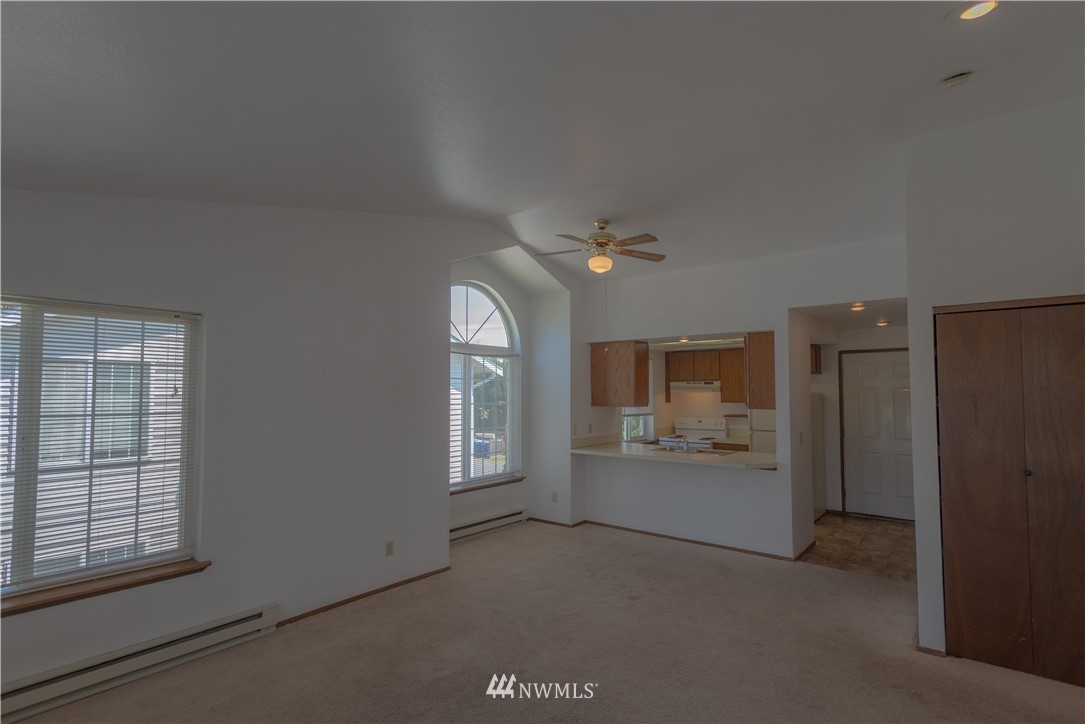 2280 Douglas Road Ferndale, WA 98248 - Photo 4 of 16 an empty room with windows cabinet and fire place