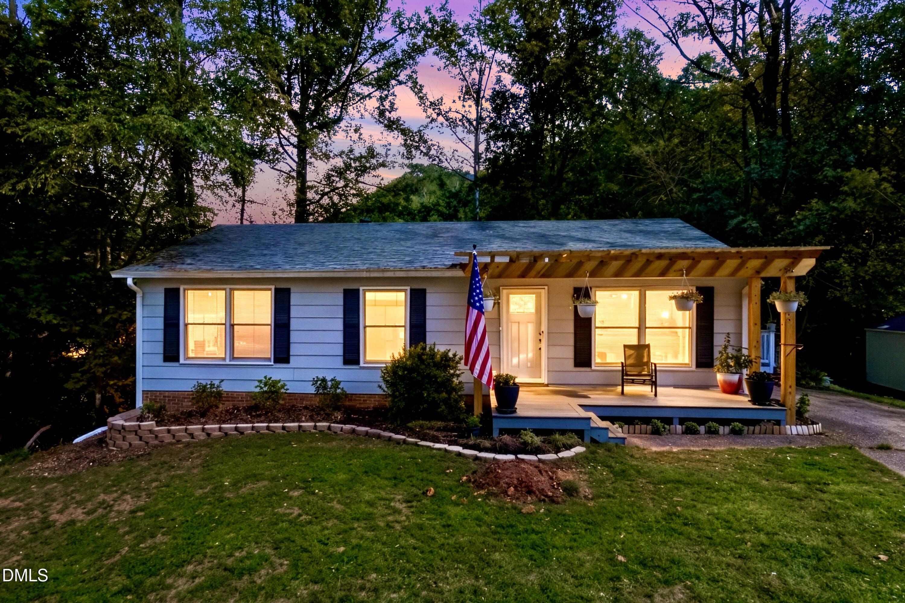 6125 Bellow Street Raleigh, NC 27609 - Photo 1 of 41 a front view of house with yard and outdoor seating