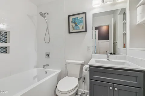 a bathroom with a sink a toilet and a bathtub