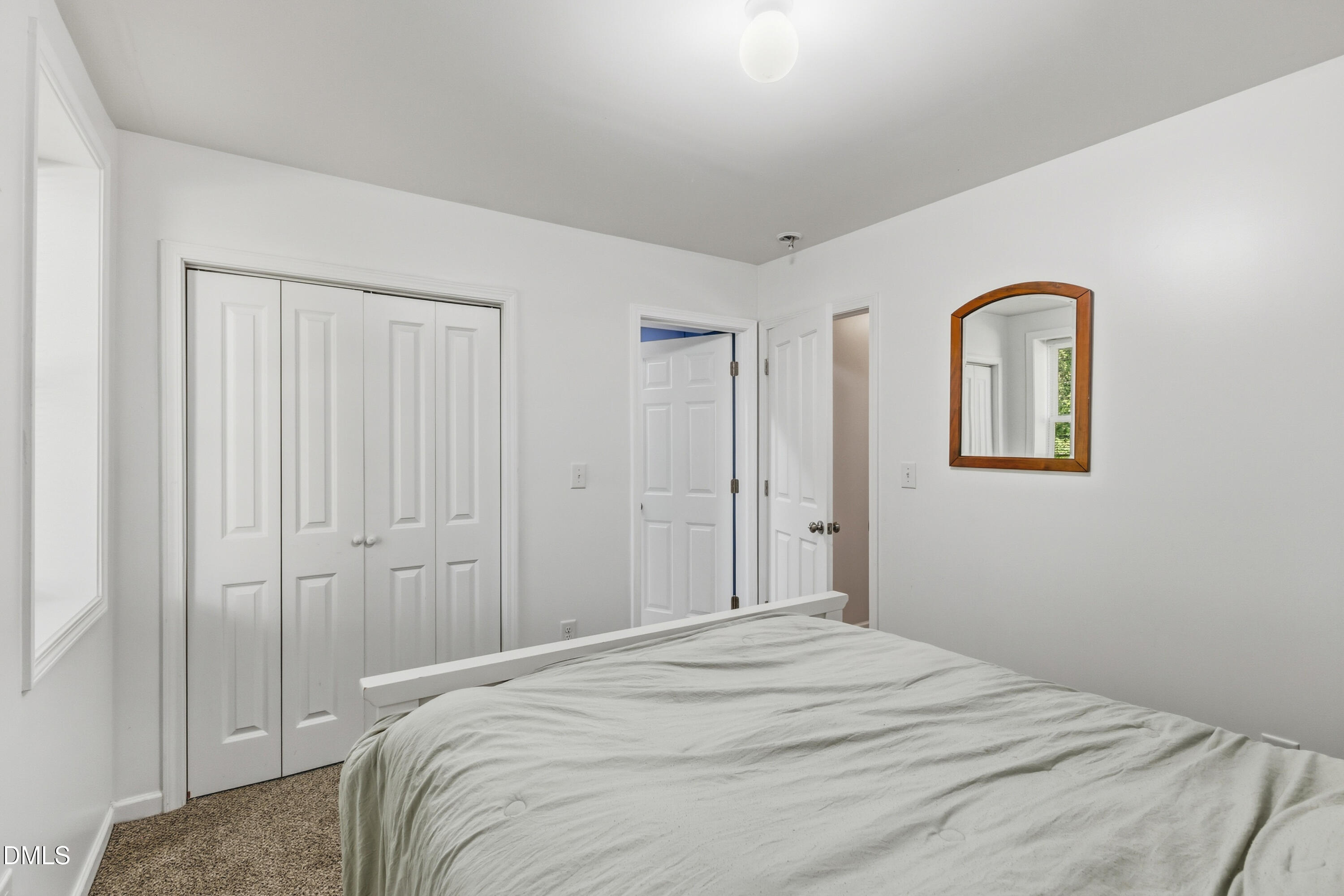 6125 Bellow Street Raleigh, NC 27609 - Photo 29 of 41 a bedroom with a bed and a window