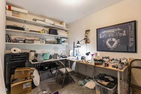 a room with furniture a rug and gym equipment