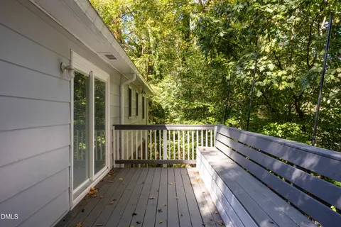 a view of balcony with wooden floor