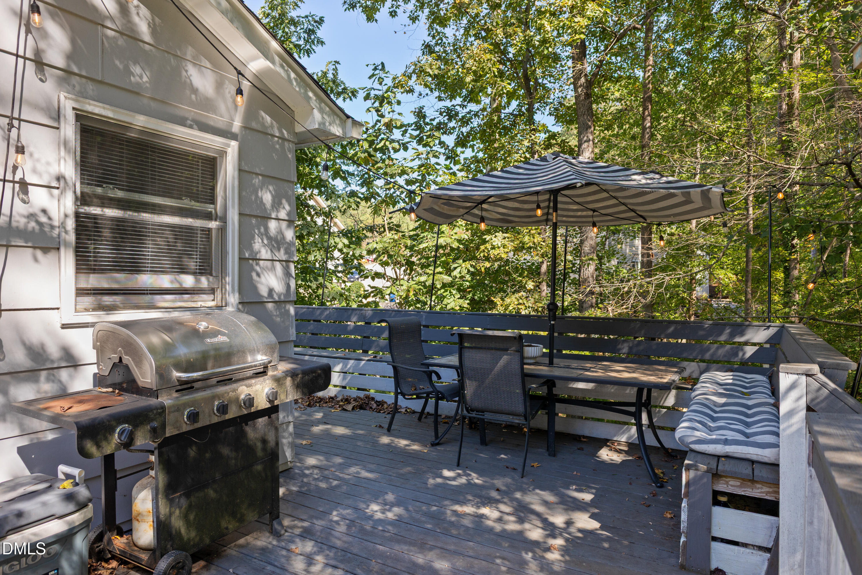 6125 Bellow Street Raleigh, NC 27609 - Photo 37 of 41 a backyard of a house with barbeque oven table and chairs